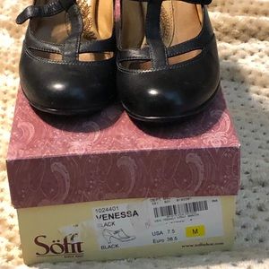 A pair of Black Sofft heels.